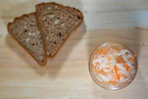 Bread and salted cabbage top view. selective focus Stock Photos