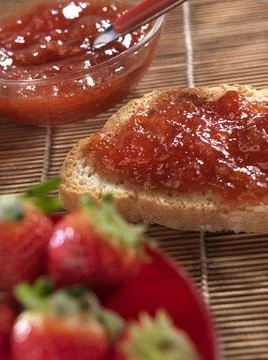 Bread and strawberries and jam for breakfast Stock Photos