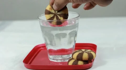 Bread and Water with Biscuits Dipped in Clear Glass Stock Footage 279268968