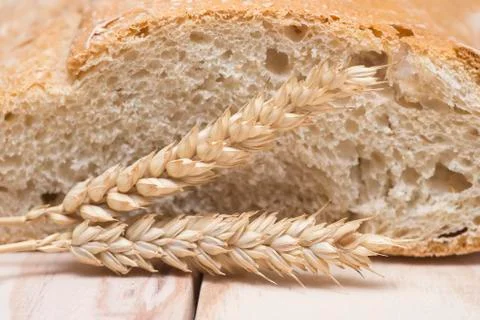 Bread and wheat ears Stock Photos