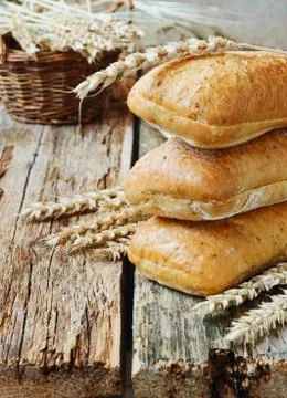 Bread and wheat ears Stock Photos