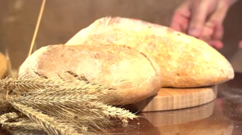 Bread and wheat ears on the table. 스톡 동영상 54700673