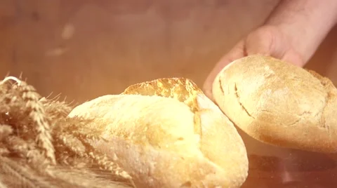 Bread and wheat ears on the table. Video stock 54700694