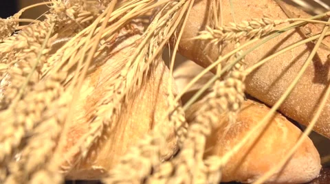 Bread and wheat ears on the table. Video stock 55903885