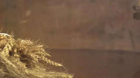 Bread and wheat ears on the table. Slow motion 240 fps. Video stock 55903913
