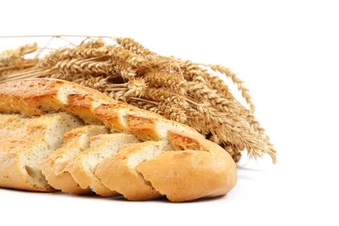 Bread and wheat ears on white background. Stock Photos