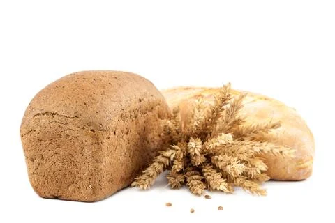 Bread and wheat ears on white background. Stock Photos