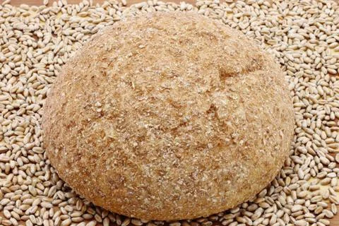Bread and wheat seeds close-up Stock Photos