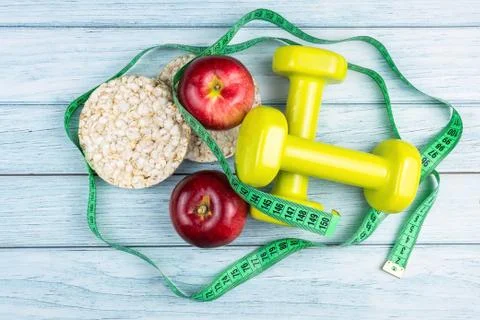 Bread Apple and dumbbells Stock Photos