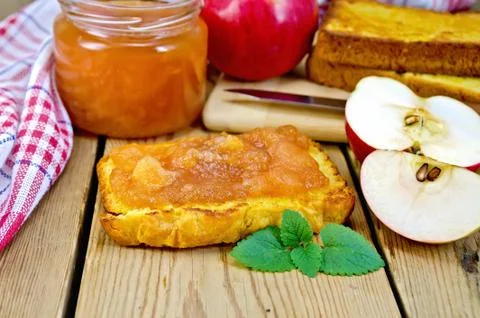 Bread with apple jam and apples on board Stock Photos