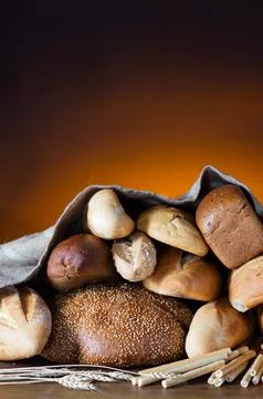 Bread assortment on fireplace background 写真素材