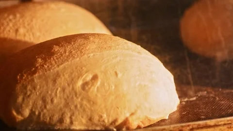 Bread backed in oven. Baking of baked goods and growth oven. Timelapse of Stock Footage