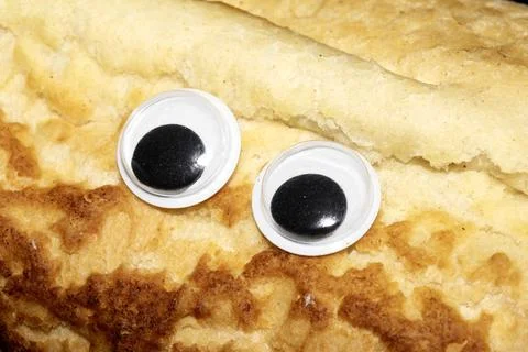 Bread Background Funny Wiggle Google Eyes on Fabric Silly Foto stock