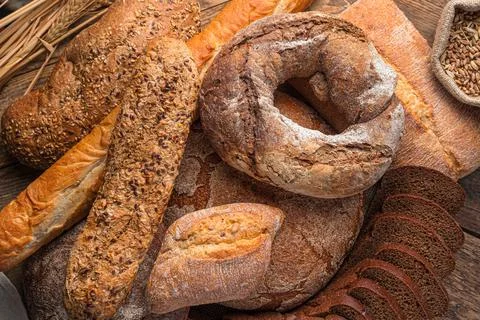 Bread background. Rye and wheat bread of different types. Stock Photos