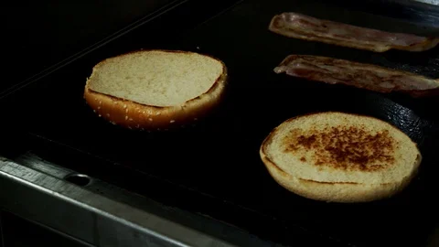 Bread bacon bake on professional barbecue moving camera slow motion Video stock 129096709