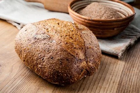 Bread. Baked bread. Craft bakery. Sliced bread on a wooden background. Food b Stock Photos