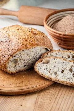 Bread. Baked bread. Craft bakery. Sliced bread on a wooden background. Food b Stock Photos
