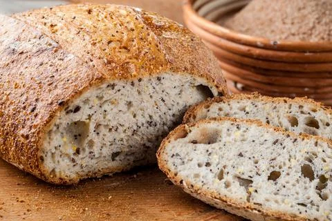 Bread. Baked bread. Craft bakery. Sliced bread on a wooden background. Food b Stock Photos