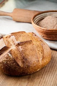 Bread. Baked bread. Craft bakery. Sliced bread on a wooden background. Food b Stock Photos