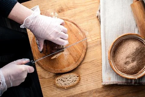 Bread. Baked bread. Craft bakery. Sliced bread on a wooden background. Food b Stock Photos