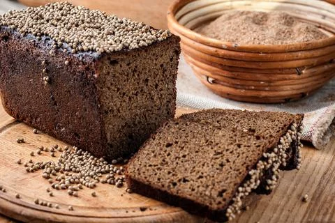 Bread. Baked bread. Craft bakery. Sliced bread on a wooden background. Food b Stock Photos