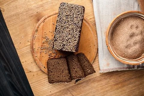 Bread. Baked bread. Craft bakery. Sliced bread on a wooden background. Food b Stock Photos