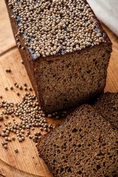 Bread. Baked bread. Craft bakery. Sliced bread on a wooden background. Food b Stock Photos