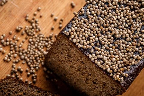 Bread. Baked bread. Craft bakery. Sliced bread on a wooden background. Food b Stock Photos