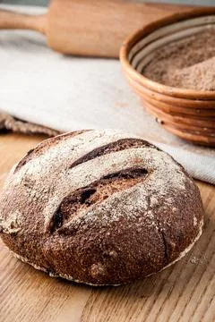 Bread. Baked bread. Craft bakery. Sliced bread on a wooden background. Food b Stock Photos