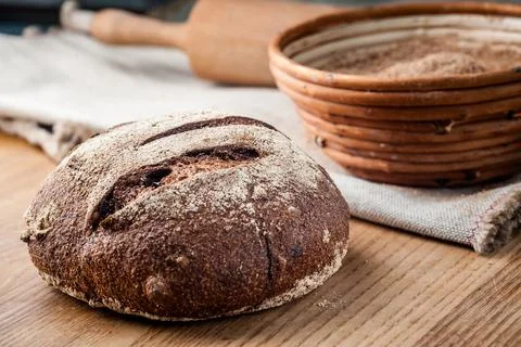 Bread. Baked bread. Craft bakery. Sliced bread on a wooden background. Food b Stock Photos