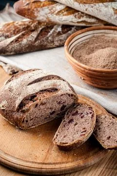 Bread. Baked bread. Craft bakery. Sliced bread on a wooden background. Food b Stock Photos