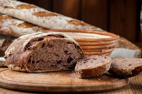 Bread. Baked bread. Craft bakery. Sliced bread on a wooden background. Food b Stock Photos