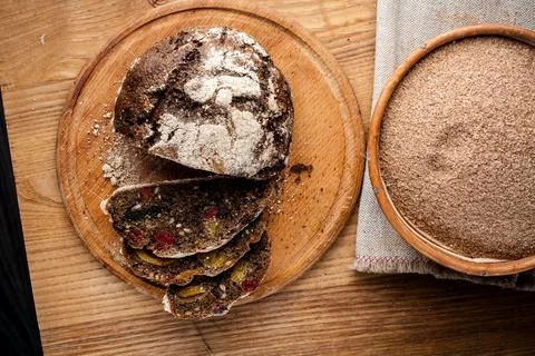 Bread. Baked bread. Craft bakery. Sliced bread on a wooden background. Food b Stock Photos