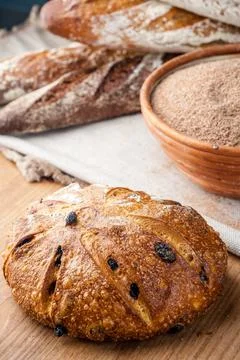 Bread. Baked bread. Craft bakery. Sliced bread on a wooden background. Food b Stock Photos