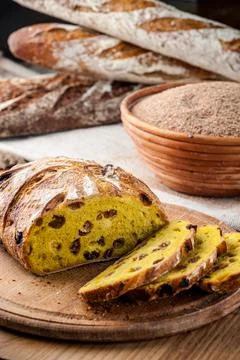 Bread. Baked bread. Craft bakery. Sliced bread on a wooden background. Food b Stock Photos