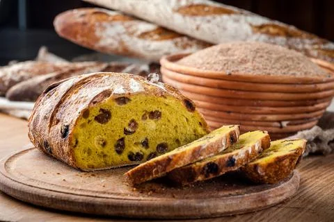Bread. Baked bread. Craft bakery. Sliced bread on a wooden background. Food b Stock Photos