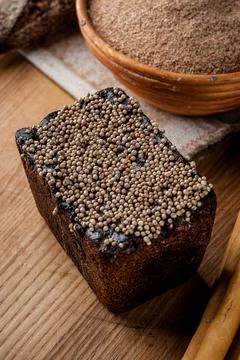 Bread. Baked bread. Craft bakery. Sliced bread on a wooden background. Food b Stock Photos