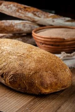 Bread. Baked bread. Craft bakery. Sliced bread on a wooden background Stock Photos