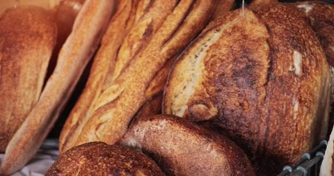 Bread - Bakery assortment of freshly baked artisan bread products Stock Footage 346792369
