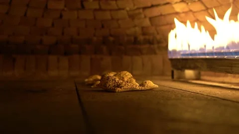Bread is baking in a stone oven Stock Footage 181873134