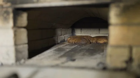 Bread baking in wood stove Stock-Footage 127848943