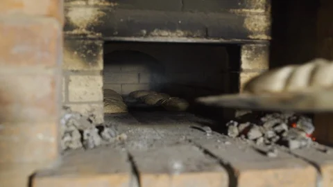 Bread baking in wood stove Stock Footage 127848977