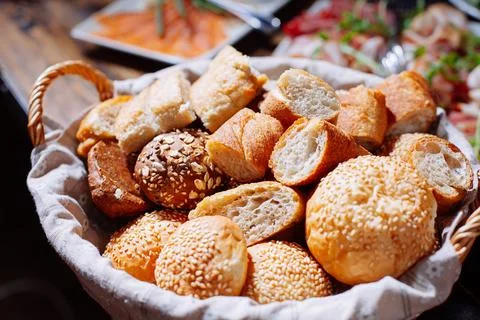 Bread in basket on the banquet table Stock Photos