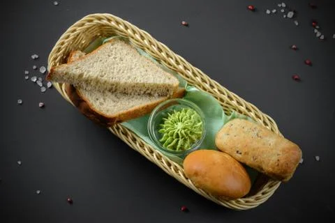 Bread basket on dark Stock Photos