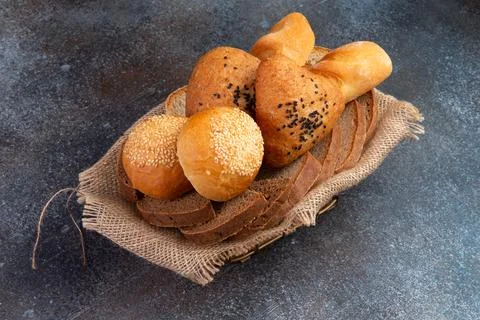 Bread basket on a gray background. Stock Photos