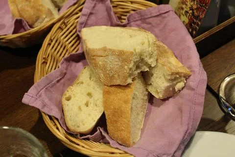 Bread in a basket is on the table in the restaurant of the cafe. Bread plate  Stock Photos