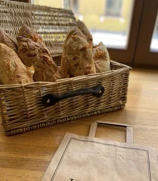 Bread in a basket on the window Stock Photos