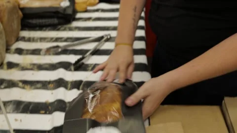 Bread Being Packaged by Vendor at Market Stall in Sydney, Australia Stock Footage 345711229