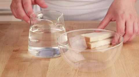 Bread being soften in lukewarm water Video stock 24671835