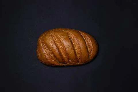 Bread on a black background. Bakery product Stock Photos